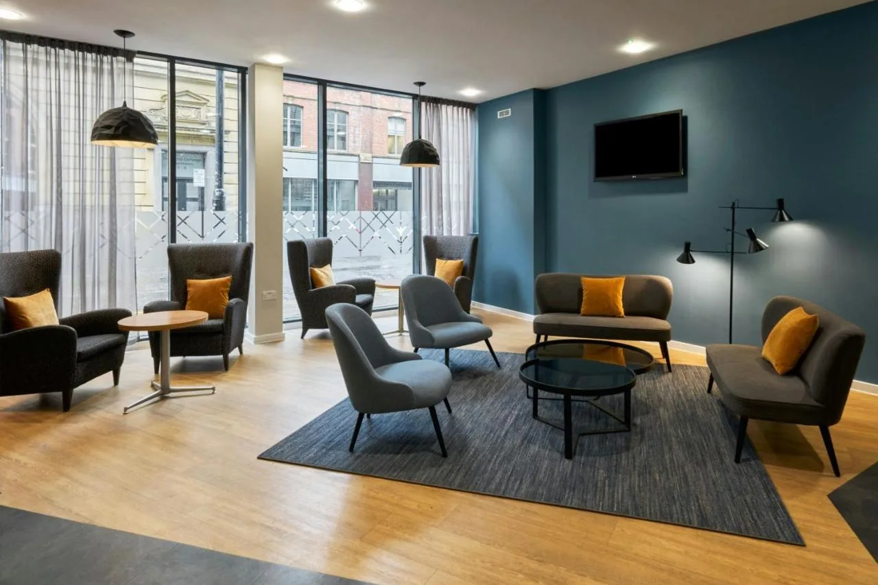Comfortable lounge with seating and a TV at the Newcastle hotel